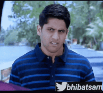 Man in Blue and Black Striped Shirt With Twitter Logo