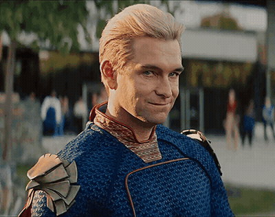 Man In Blue And Gold Outfit Smiling GIF