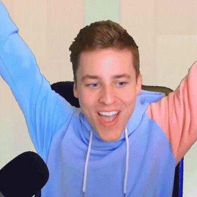 Man In Blue And Pink Hoodie Smiling With Arms Outstretched GIF