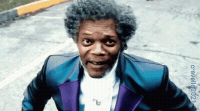 Man In Blue And Purple Suit On Street GIF