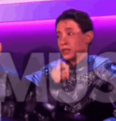 Man In Blue And Silver Suit At M Sign GIF