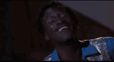 Man In Blue And Silver Suit Laughing GIF