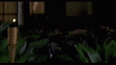 Man In Blue And White Jacket And White Hat In Dark Room GIF