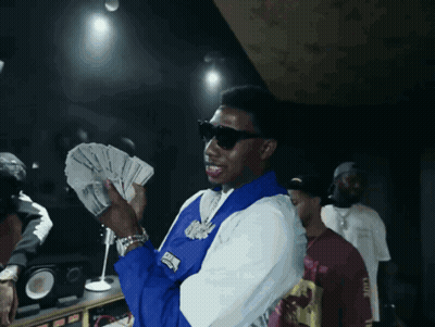 Man In Blue And White Jacket Holding Money GIF