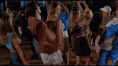 Man In Blue And White Jacket Surrounded By Women GIF
