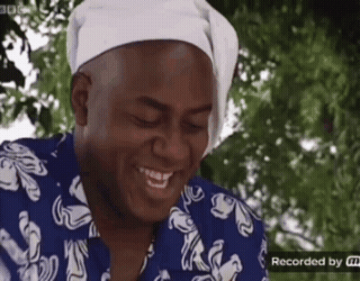 Man In Blue And White Shirt With Headband Smiling GIF