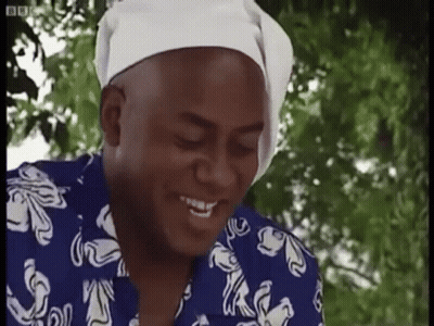 Man In Blue And White Shirt With Headband Smiling GIF
