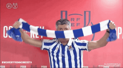 Man In Blue And White Striped Shirt Holding Scarf GIF
