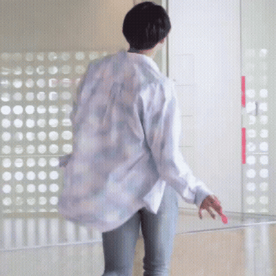 Man In Blue And White Striped Shirt In Front Of Mirror GIF