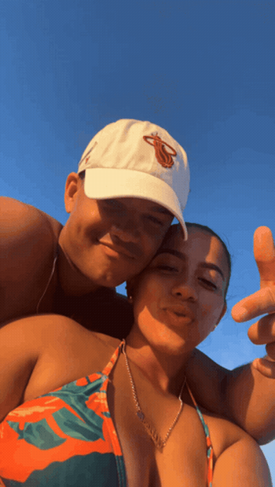 Man In Blue And White Sweater With Woman And Man In Suit GIF