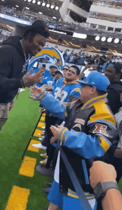 Man In Blue And Yellow Jacket With Letter R GIF