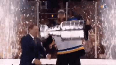 Man In Blue And Yellow Jersey Holding Hockey Trophy GIF