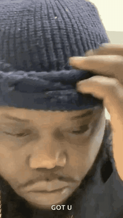 Man in Blue Beanie Saying Got U
