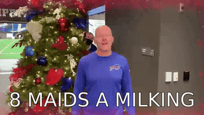 Man In Blue Bills Shirt By Christmas Tree GIF