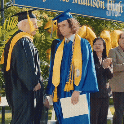 Man In Blue Cap And Gown GIF