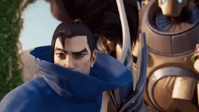 Man In Blue Cape With Robot Looking At Camera GIF