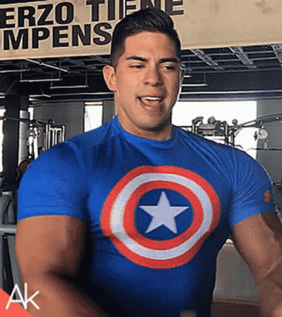 Man In Blue Captain America Shirt At Erzo Tiene Mpens Sign GIF