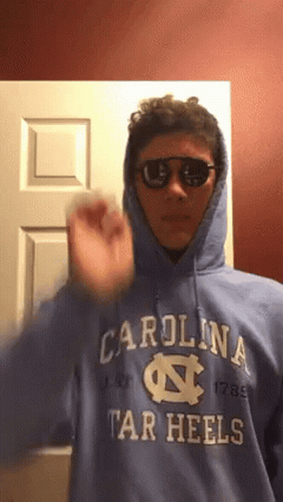 Man In Blue Carolina Tar Heels Hoodie And Sunglasses GIF