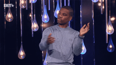 Man In Blue Christian Dior Sweater In Front Of Lights GIF