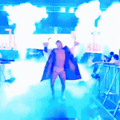 Man In Blue Coat Holding Adi Sign In Front Of Crowd GIF
