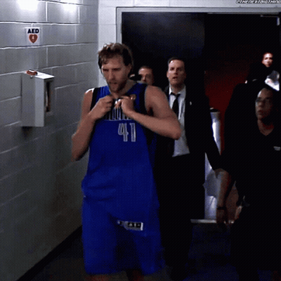Man In Blue Dallas Jersey Walking Through Hallway GIF