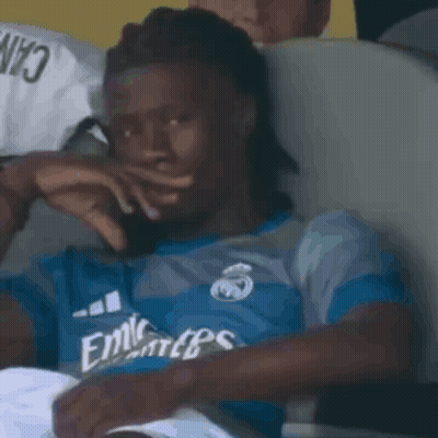 Man In Blue Emirates Shirt Covering Mouth GIF