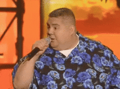 Man In Blue Floral Shirt Singing Into Microphone GIF