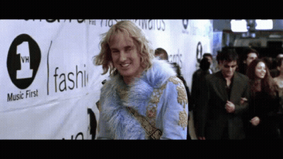 Man In Blue Fur Coat With Music First Sign GIF