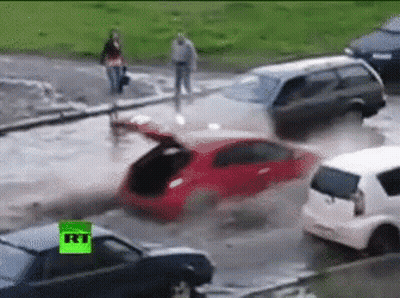 Man In Blue Hard Hat By Flooding Pipe GIF