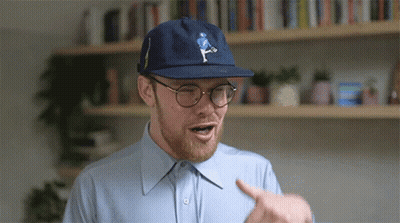Man In Blue Hat And Glasses Pointing GIF