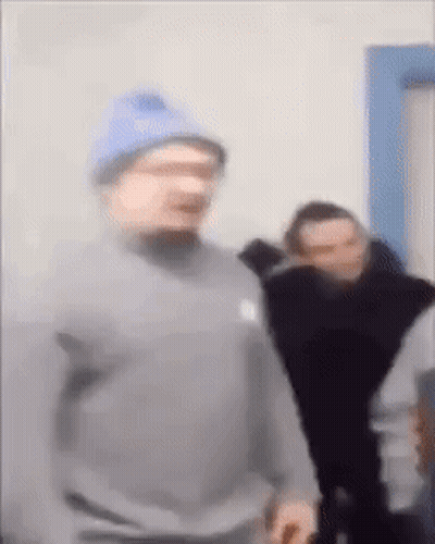 Man In Blue Hat And Gray Sweatshirt GIF