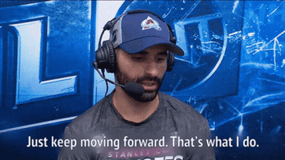 Man In Blue Hat And Headphones Says Keep Moving Forward GIF