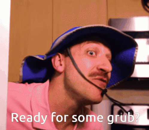 Man In Blue Hat And Pink Shirt Ready For Some Grub GIF