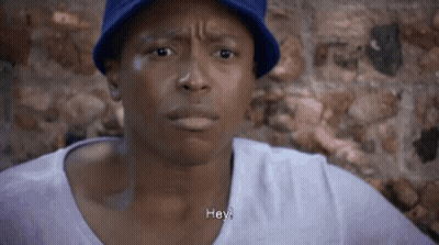Man In Blue Hat And Purple Shirt Saying Hey GIF