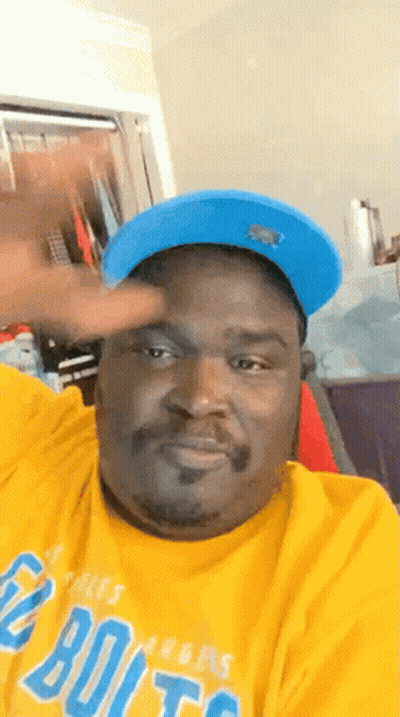 Man In Blue Hat And Yellow Denver Broncos Shirt GIF