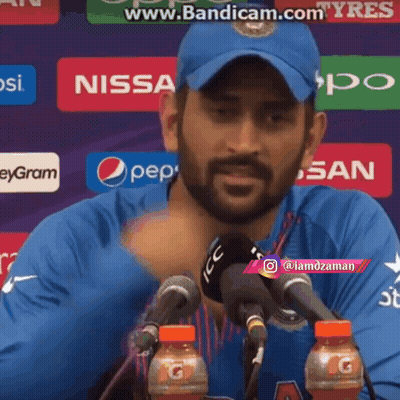 Man In Blue Hat At Microphone With Pepsi And Gatorade GIF