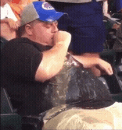Man In Blue Hat Eating Chips In Stadium GIF