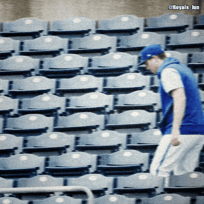 Man In Blue Hat In Front Of Blue Seats GIF