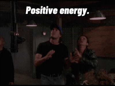 Man In Blue Hat In Front Of Weaponless Sign GIF