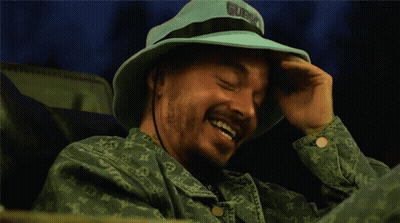 Man In Blue Hat Saying Guns GIF