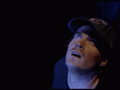 Man In Blue Hat Saying LA Looking At Something GIF
