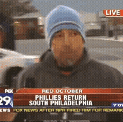 Man In Blue Hat Talking Into Microphone On Fox News GIF
