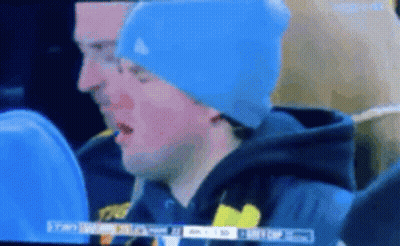 Man In Blue Hat Watching TV GIF