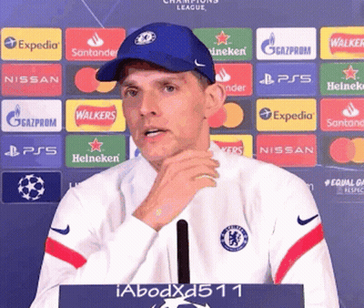 Man In Blue Hat With Heineken Nissan Expedia Logos GIF