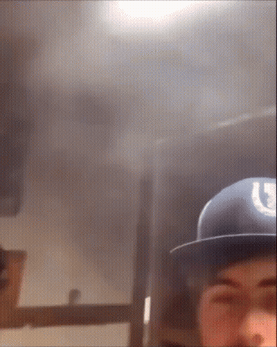 Man In Blue Hat With Horseshoe GIF