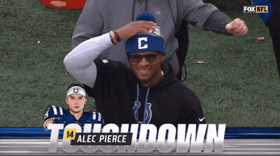 Man In Blue Hat With Letter C In Front Of Fox NFL Logo GIF