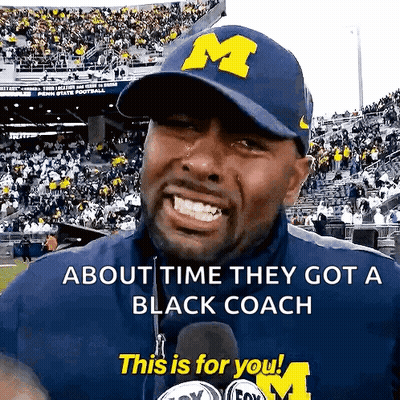 Man In Blue Hat With Letter M Says About Time They Got A Black Coach This Is For You GIF