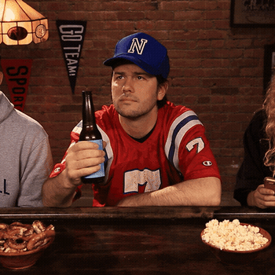Man In Blue Hat With Letter N Holding Beer GIF