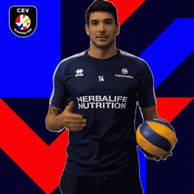 Man In Blue Herbalife Nutrition Shirt Holding Volleyball GIF
