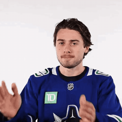 Man In Blue Hockey Jersey Clapping GIF